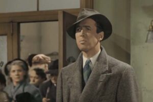 uomo con cappotto e cappello